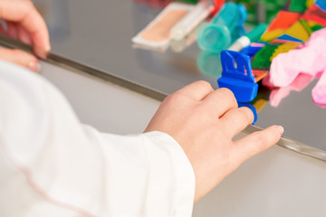 Hands of nurse preparing tools for blood test at the laboratory.