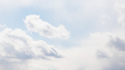 Light pale soft sky with delicate white clouds, 16:9 panoramic format