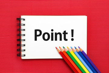 スケッチブックに描かれたPOINTと色鉛筆