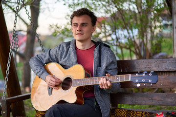 Playing guitar in the countryside