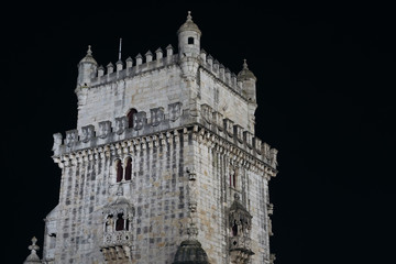 Fototapeta na wymiar Illuminated Belem Tower at night in Lisbon, Portugal