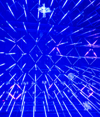 blurry bokeh image of unusual club and street decoration, consists of a large number of blue bulbs