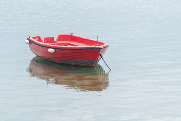wooden fishing boat anchored near the coast