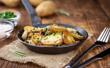 Fresh made Fried Potatoes (selective focus; close-up)