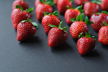 Top view on strawberry frame on blue background. Summer nature background. Berries pattern. Flat lay