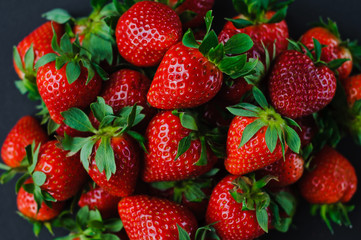 Vegetables and fruits in one color, background from freshly harvested strawberries, Fresh strawberry background,
