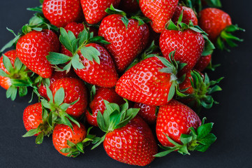 Vegetables and fruits in one color, background from freshly harvested strawberries, Fresh strawberry background,