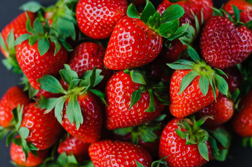 Vegetables and fruits in one color, background from freshly harvested strawberries, Fresh strawberry background,