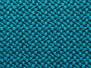 Closeup of blue, turquoise, black fabric, abstract background.