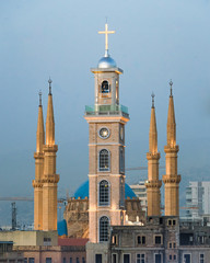 Saint George Maronite Cathedral's new bell tower in front of al-Amin mosque in downtown Beirut,...