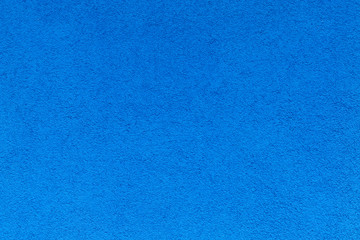 Rough blue wall texture background.