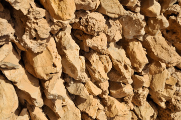 Stone and mud wall, Ruined ancient old Arab pearling and fishing village The desert at coast of Persian Gulf. 