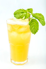 iced yellow drink in a tall glass