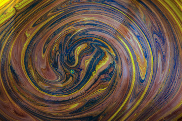 Liquid abstract paint background. Fluid painting texture. Colorful mix of acrylic vibrant colors.