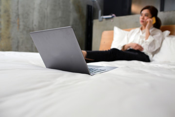 woman work from home on the bed