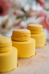 Yellow mousse dessert with French cookie decoration