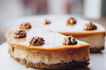 delicious caramelized nut cheesecake on the table in cafe