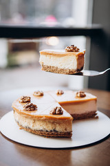 delicious caramelized nut cheesecake on the table in cafe