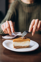 delicious caramelized nut cheesecake on the table in cafe