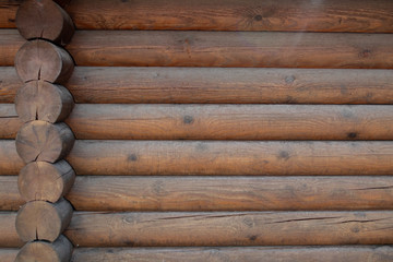 Background backsplash countrystyle wooden fence made from panels in rustic ecological style log