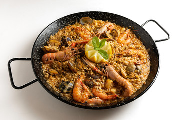 Spanish seafood paella with rustic dark white - image
