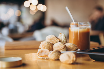 walnut biscuits and a jar of condensed milk, a recipe for making delicious homemade cookies. Copy space