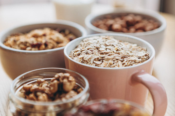a delicious and crunchy oatmeal granola with honey, nuts, dried fruits and grains. Dynamic healthy food photography