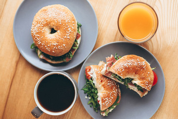 delicious and appetizing breakfast: a bagel stuffed on a plate