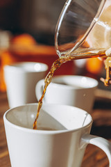 The coffee is alternatively made using a paper filter and a kemex is poured from the flask into a mug. Third wave cafe