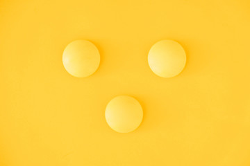 Yellow balls on yellow background. Minimal concept. Top view. Copy, empty space for text