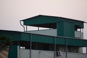 Fototapeta premium Buildings in a township under the sky during sunset. Indian city and architecture.