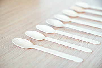 no plastic, clean, disposable food appliances, light wood spoons, with space for text and space for copying