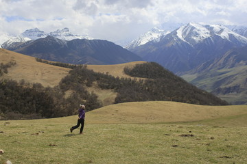 Fototapeta premium Girl is running in the mountains