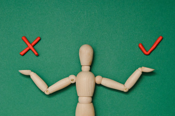 Wooden mannequin with empty miniature shopping cart running for sales on red background. Mockup for shopping, sales, black friday, copy space, side view.