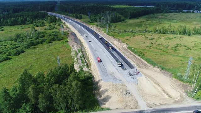 Highway construction. Development asphalt transport road. Top Aerial View.
