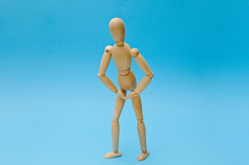 Wooden dummy proudly presents some invisible thing, isolated on white background, copy space for your object or text