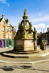 The well at The Cross, Linlithgow, reconstructed in 1807 after damage by Cromwell's forces in 1650.  The Cross is a small square in the centre of the town.