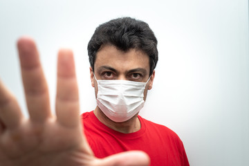 Man dressing a mask for diseases protection.