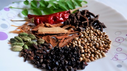 Spices of Kerala. Cinnamon, pepper, clove, star anise,  cardamom, nutmeg and curry leaves ,main  ingredients of Kerala cuisine. 