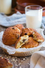 Healthy homemade oatmeal cookies with raisins and glass of milk