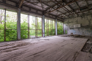 Hall in abandoned swimming pool in ghost town Pripyat