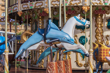 Colorful merry-go-round with animal figures. Empty vintage carousel in park. Retro roundabout....