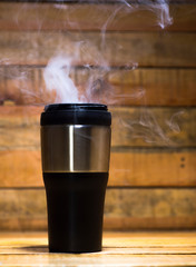 cup of coffee on wood table