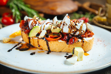Bruschetta with avocado cheese and vegetables