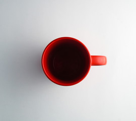 red mug on a white background view from above