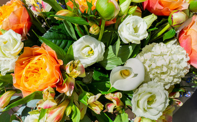 Wonderful bouquet with orange peonies and various flowers. Spring and colorful composition