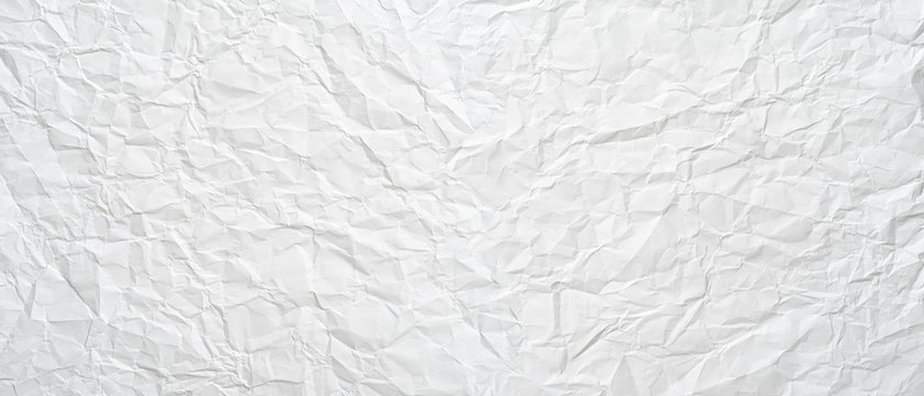 Texture of a white crumpled sheet of paper as a background