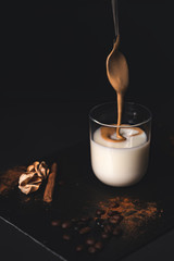 Dalgona coffee, soft, sparkling coffee with milk and a touch of cinnamon