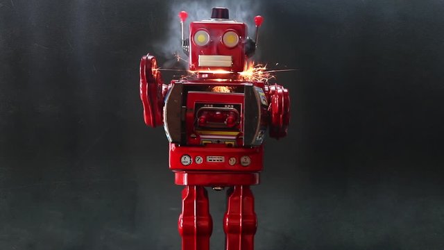 a retro red robot with black textured background 