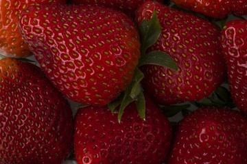 Close up view macro of fresh colorful strawberry isolated on background. Beautiful background.